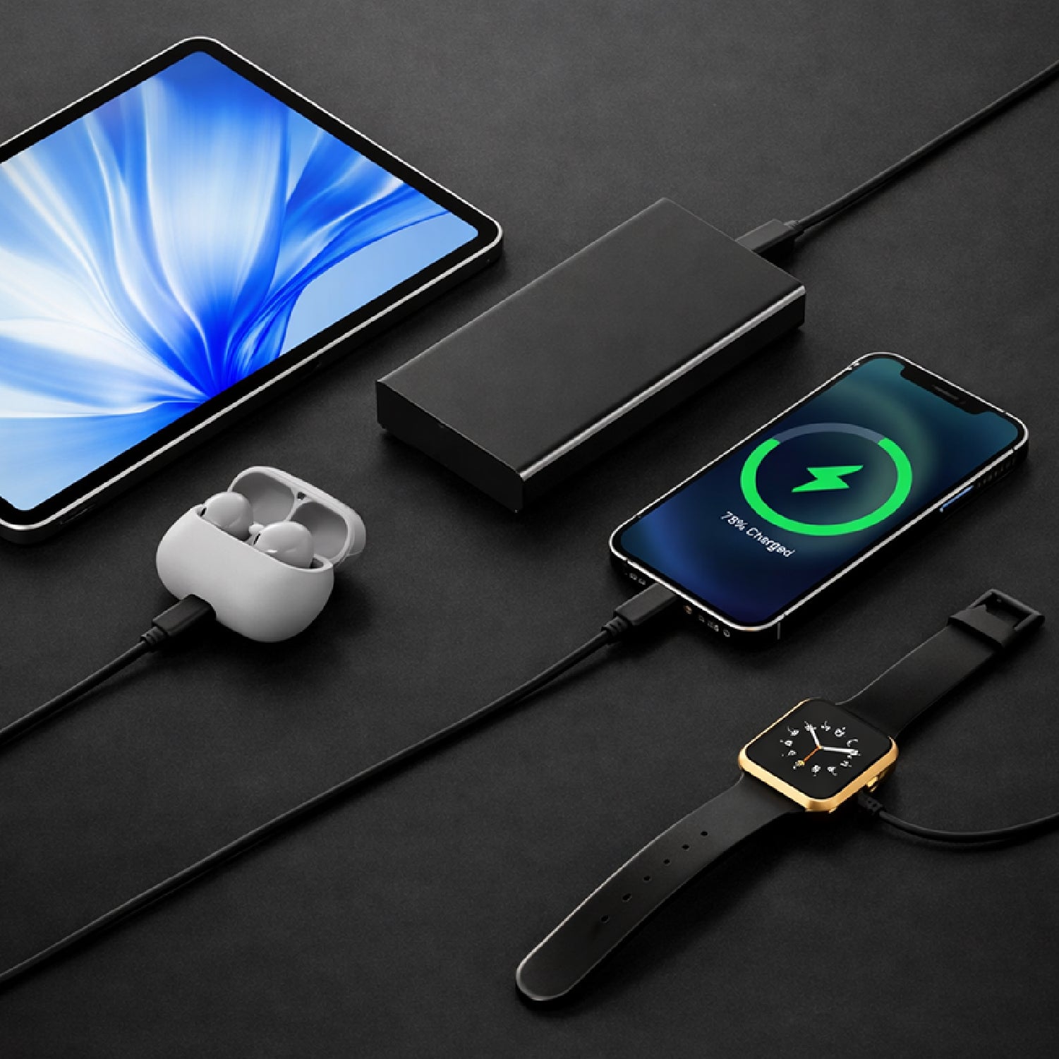 Smartphone, wireless earbuds, power bank, and smartwatch on a dark surface