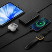 Smartphone, wireless earbuds, power bank, and smartwatch on a dark surface